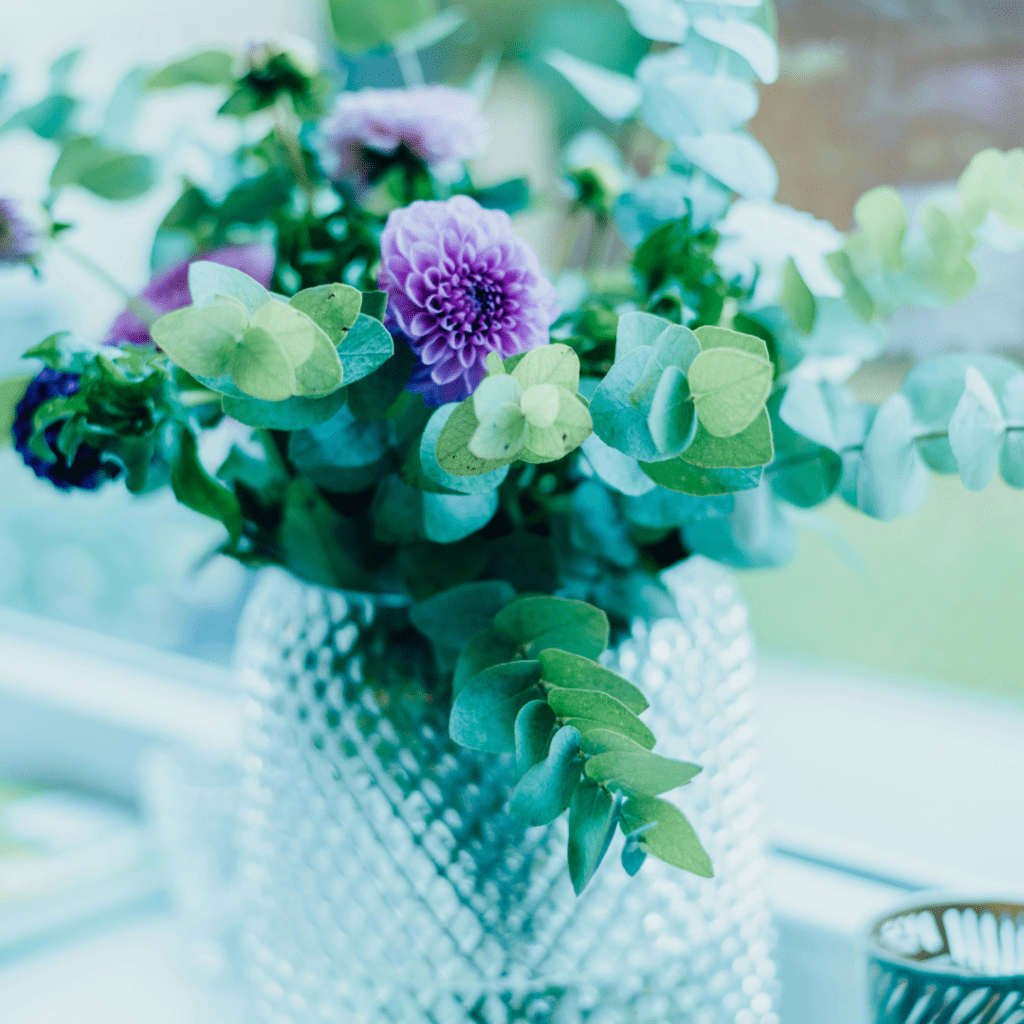 A beautiful flower bouquet with purple flowers and eucalyptus.